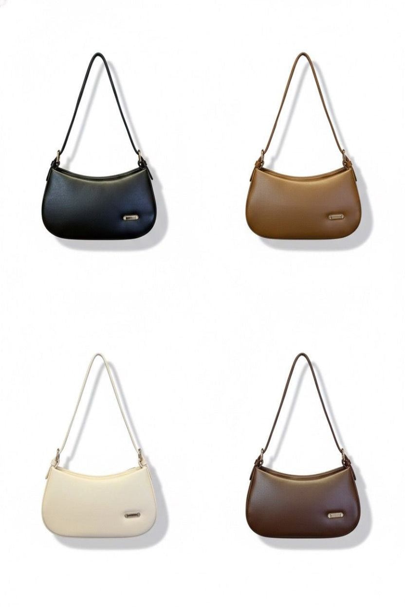 Four handbags in black, brown, beige, and white on a white background