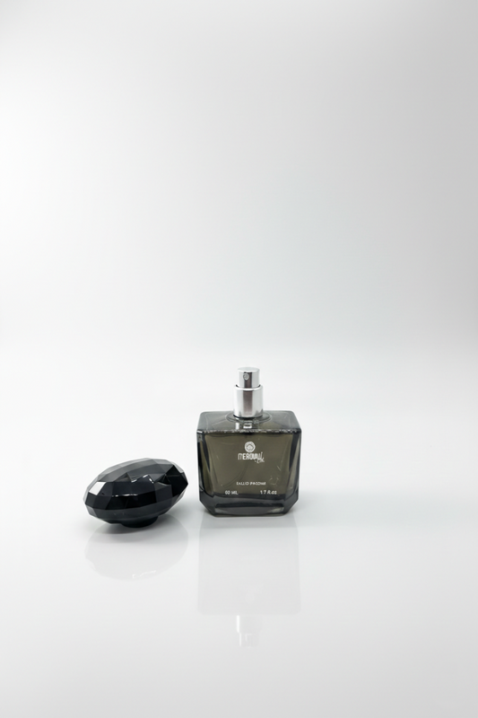 Black perfume bottle and cap on a white background