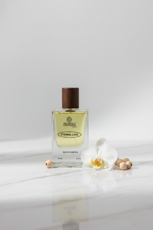 Perfume bottle labeled 'Eternal Love' by Merou on a white surface with a light gray background