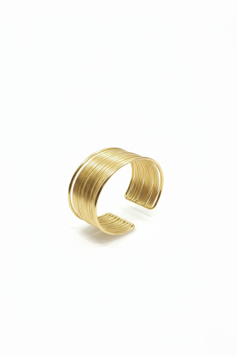 Gold bracelet on a white background